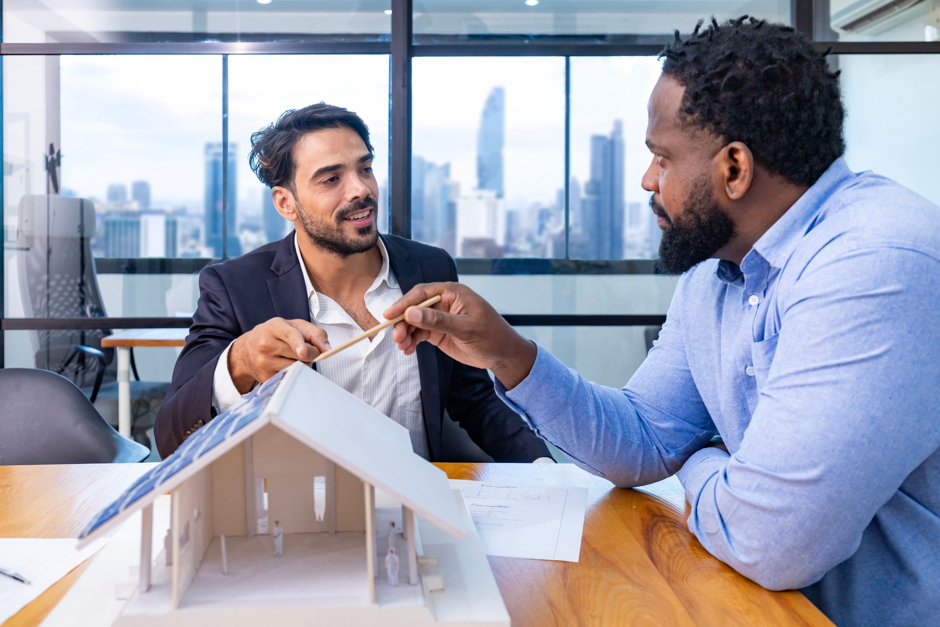 Team of architecture and businessmen are discussing and brainstorming on floor plan modification for real estate investment and housing development project